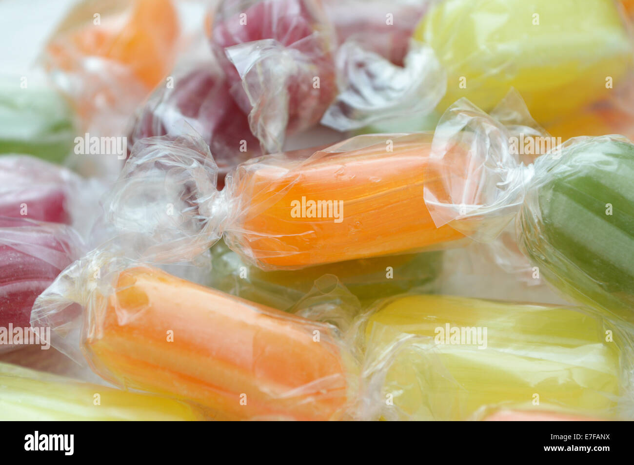 colourful sugary boiled sweets in cellophane wrappers Stock Photo