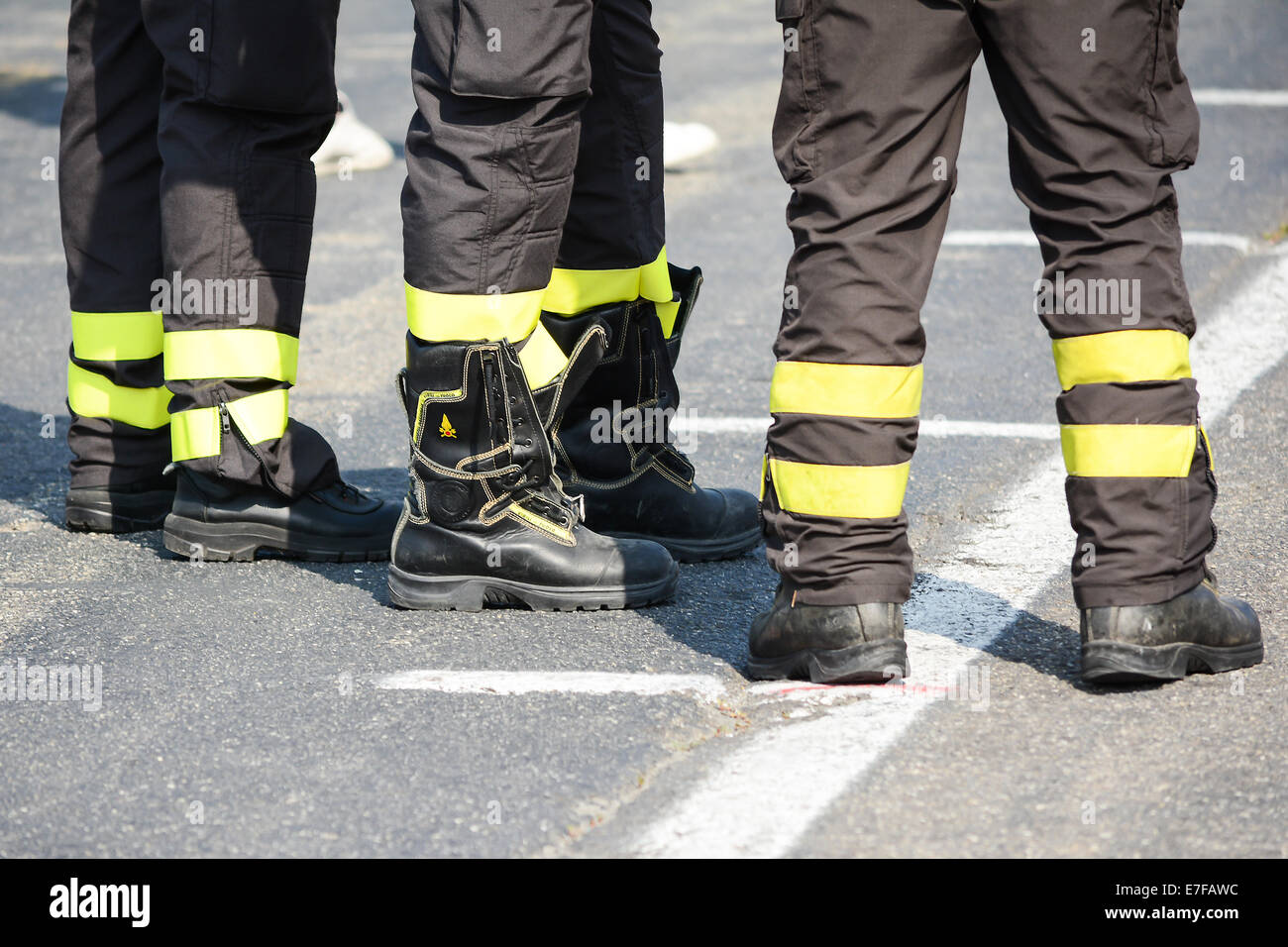 bologna,Italy-June 7,2014:three firefighters oversee the situation during the course of a sporting event in bologna in a sunny d Stock Photo