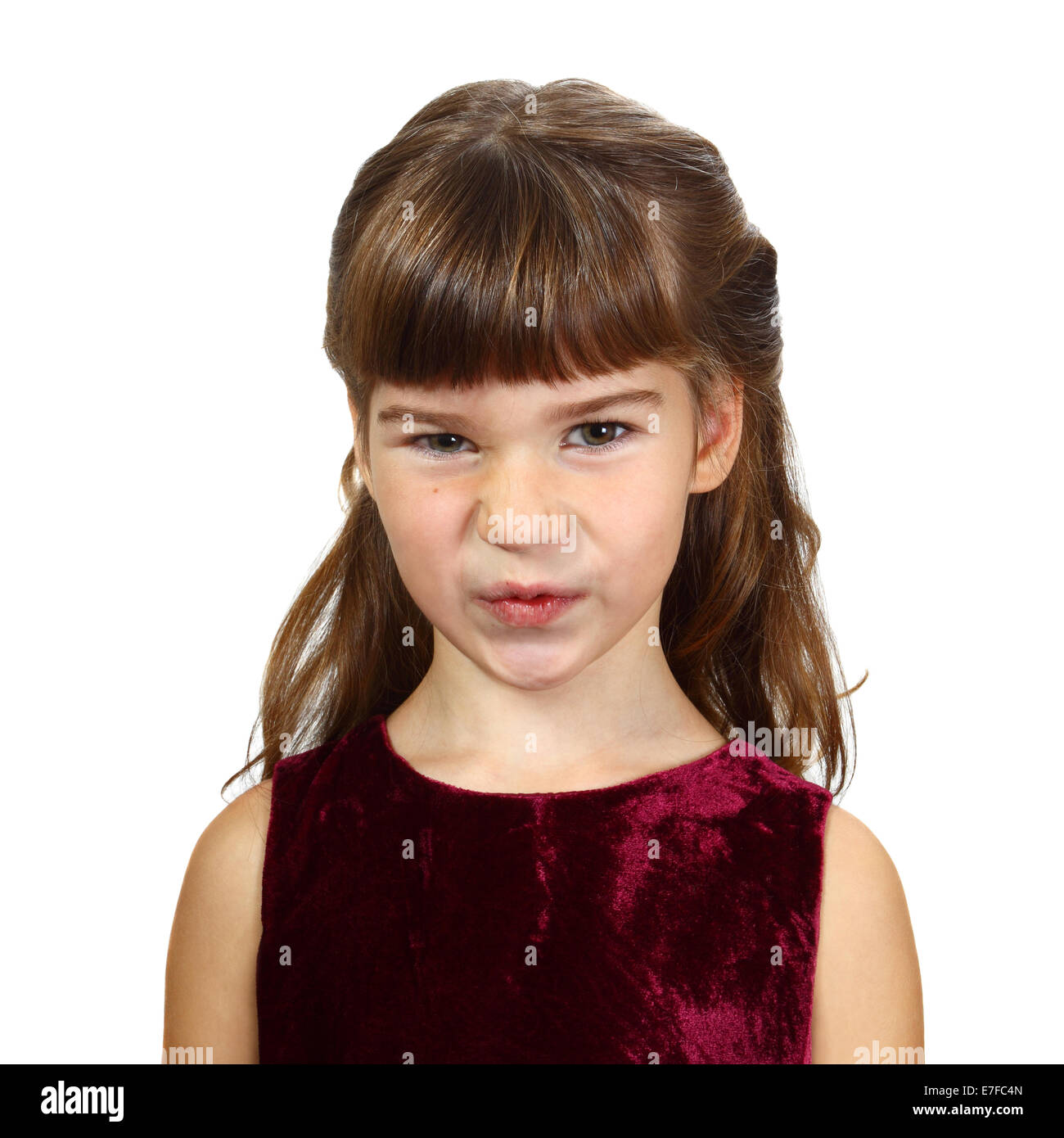 Little girl with a scornful glance. Portrait isolated on white background Stock Photo