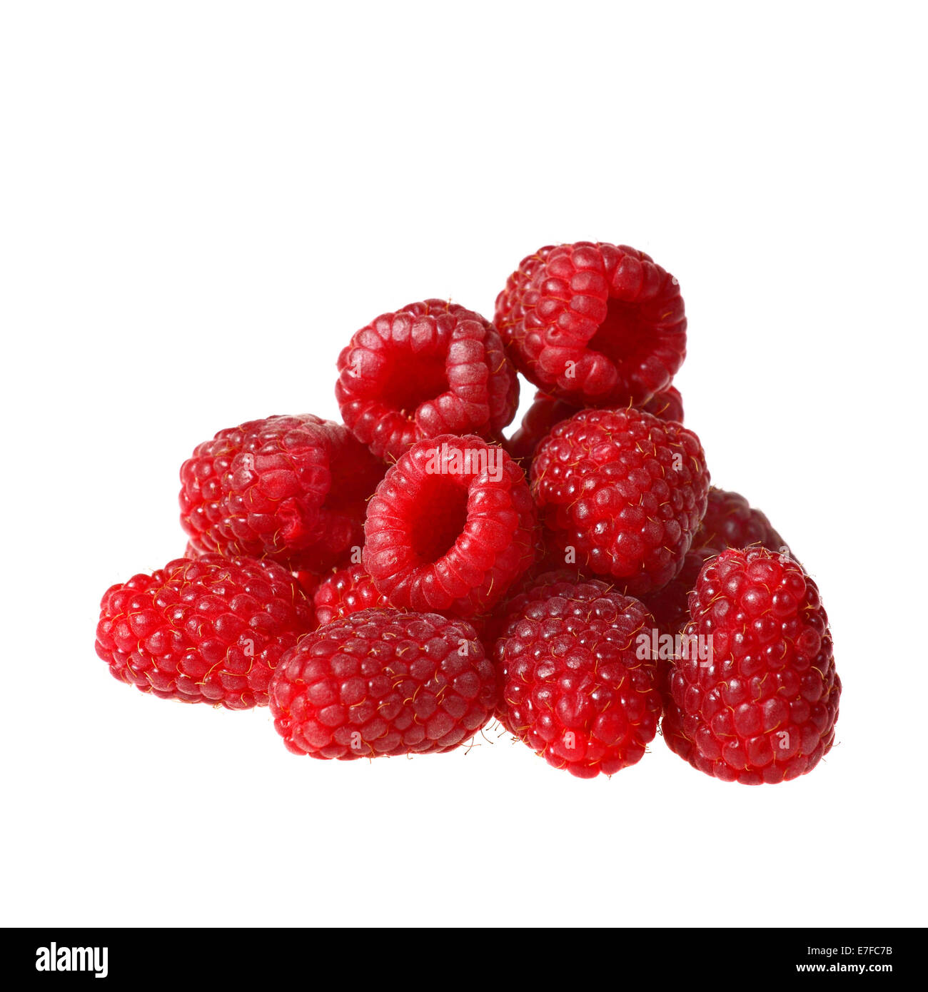 Raspberries in heap closeup isolated on white background Stock Photo