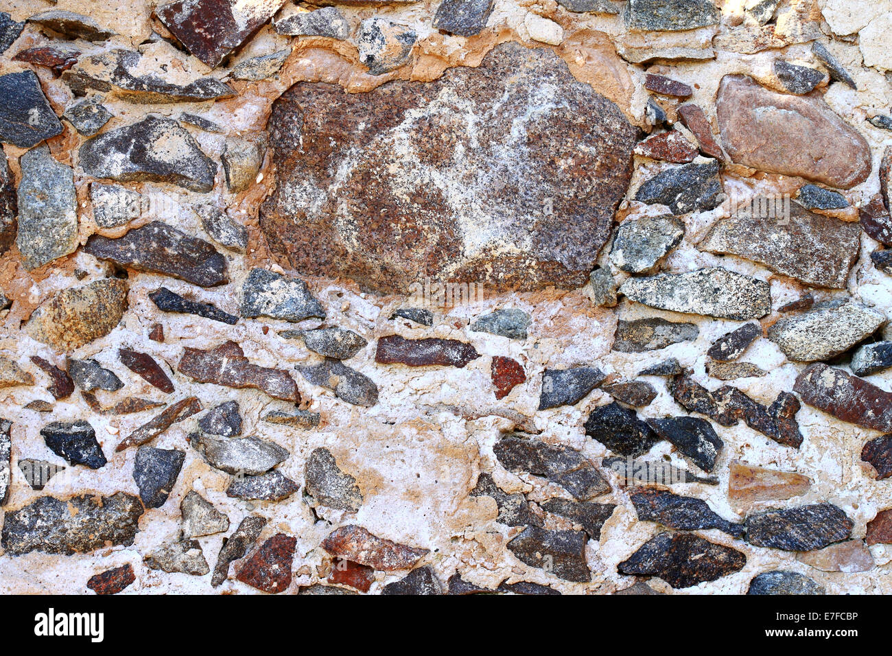 Ancient wild stone wall background Stock Photo