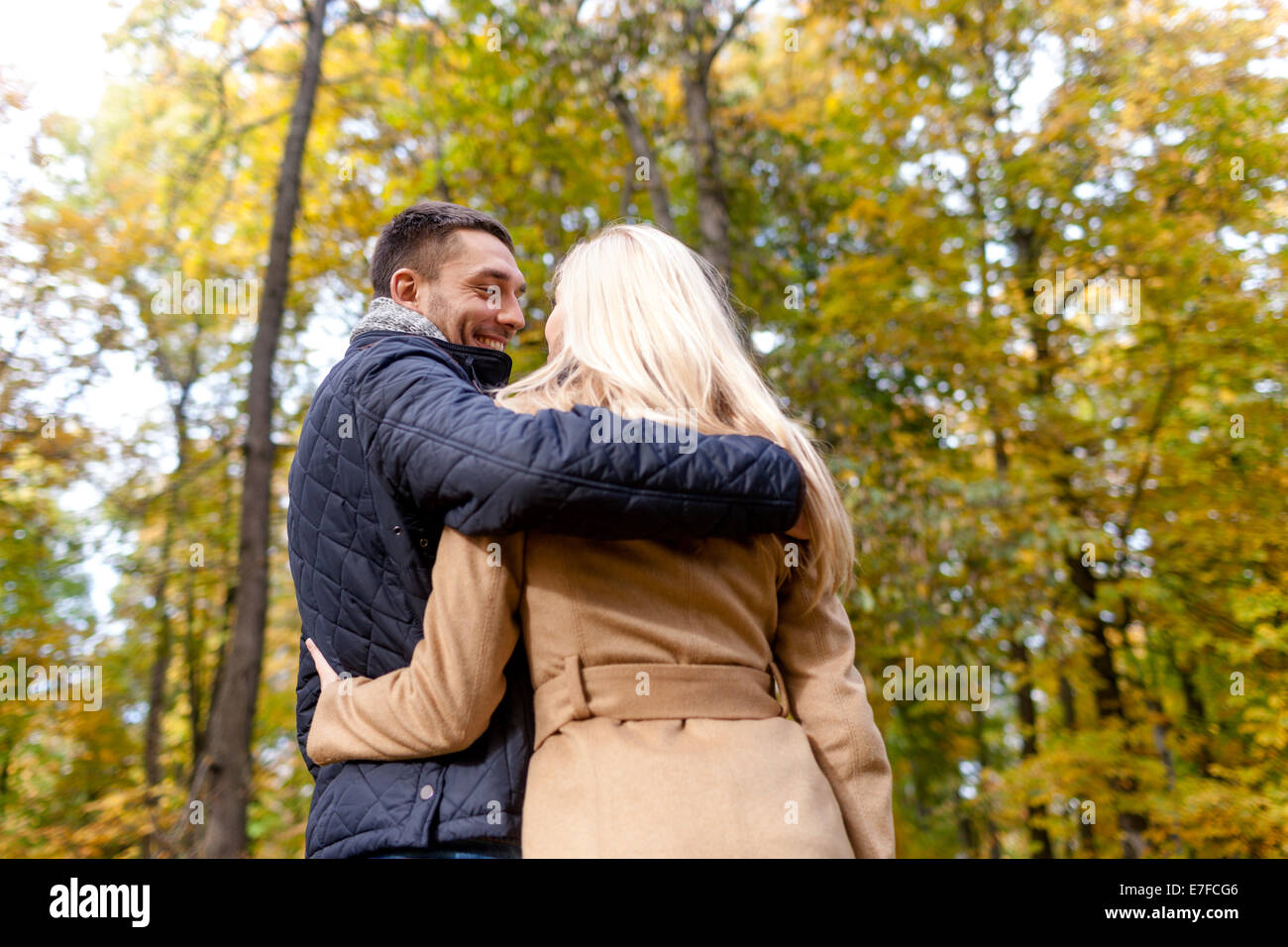 smiling couple hugging in autumn park Stock Photo - Alamy