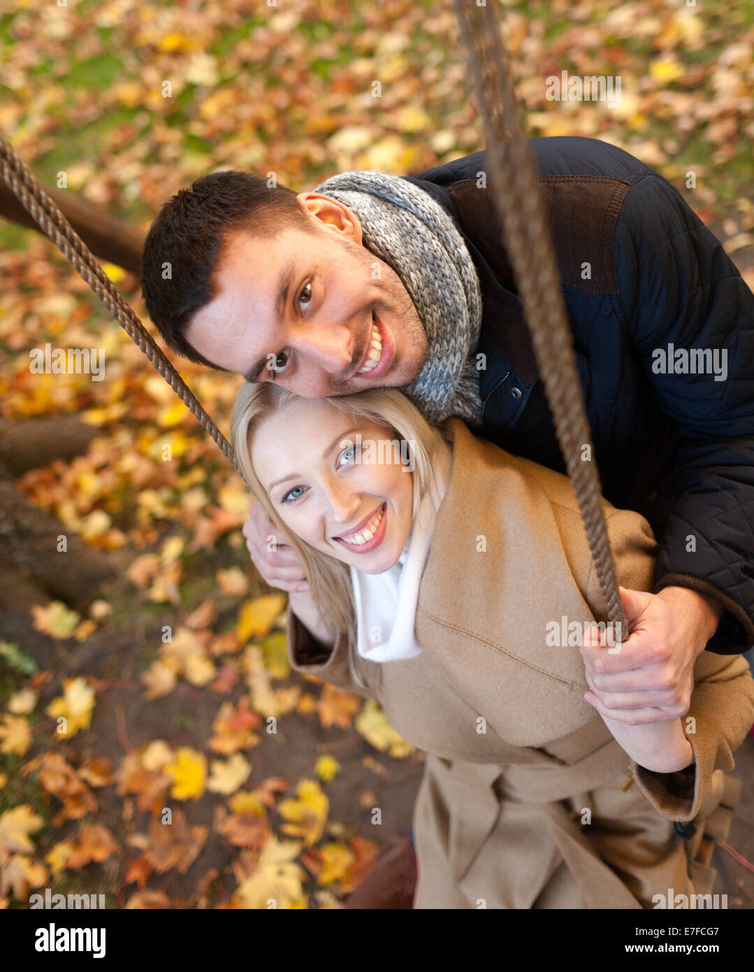 smiling couple hugging in autumn park Stock Photo - Alamy