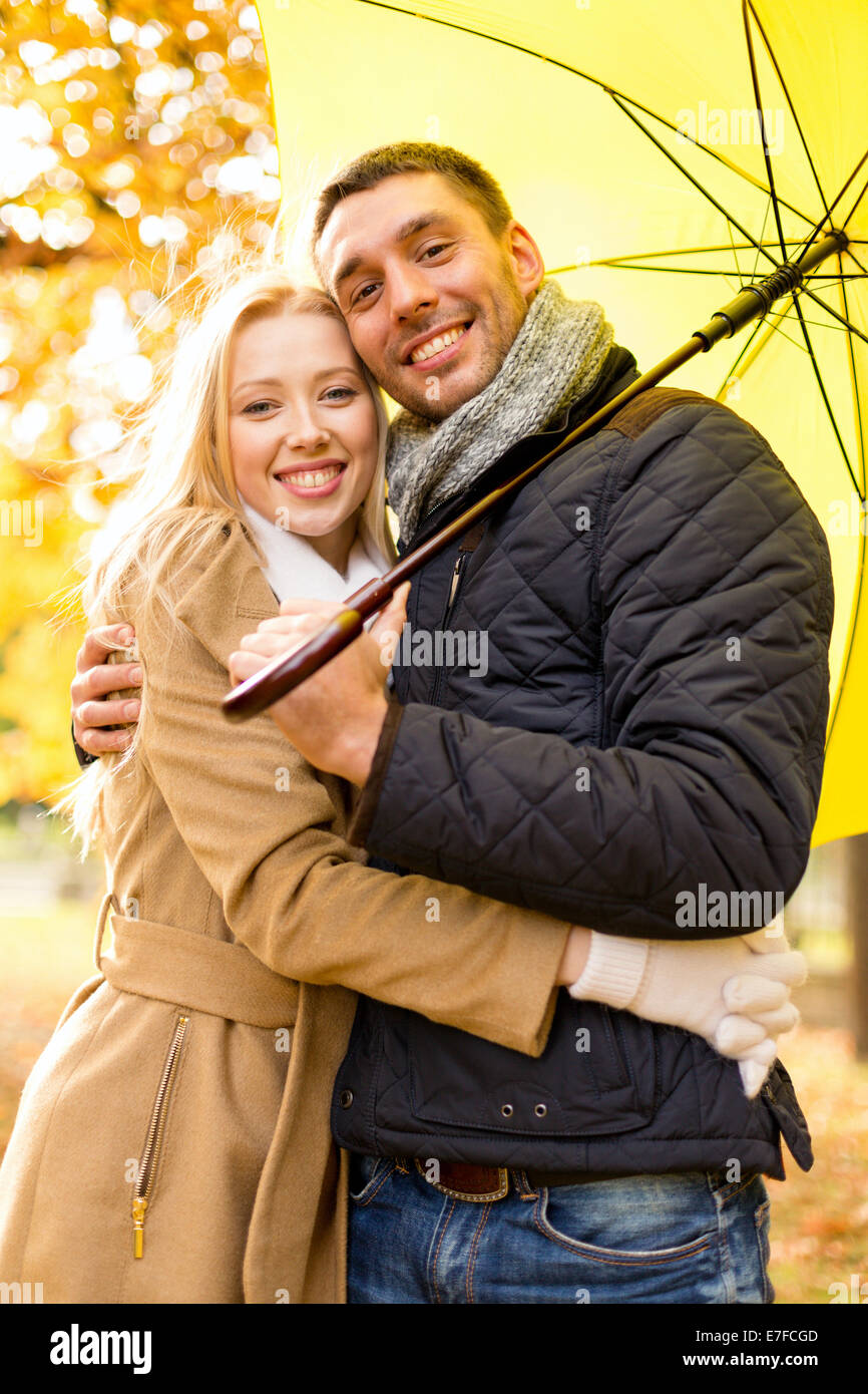 smiling couple hugging in autumn park Stock Photo - Alamy