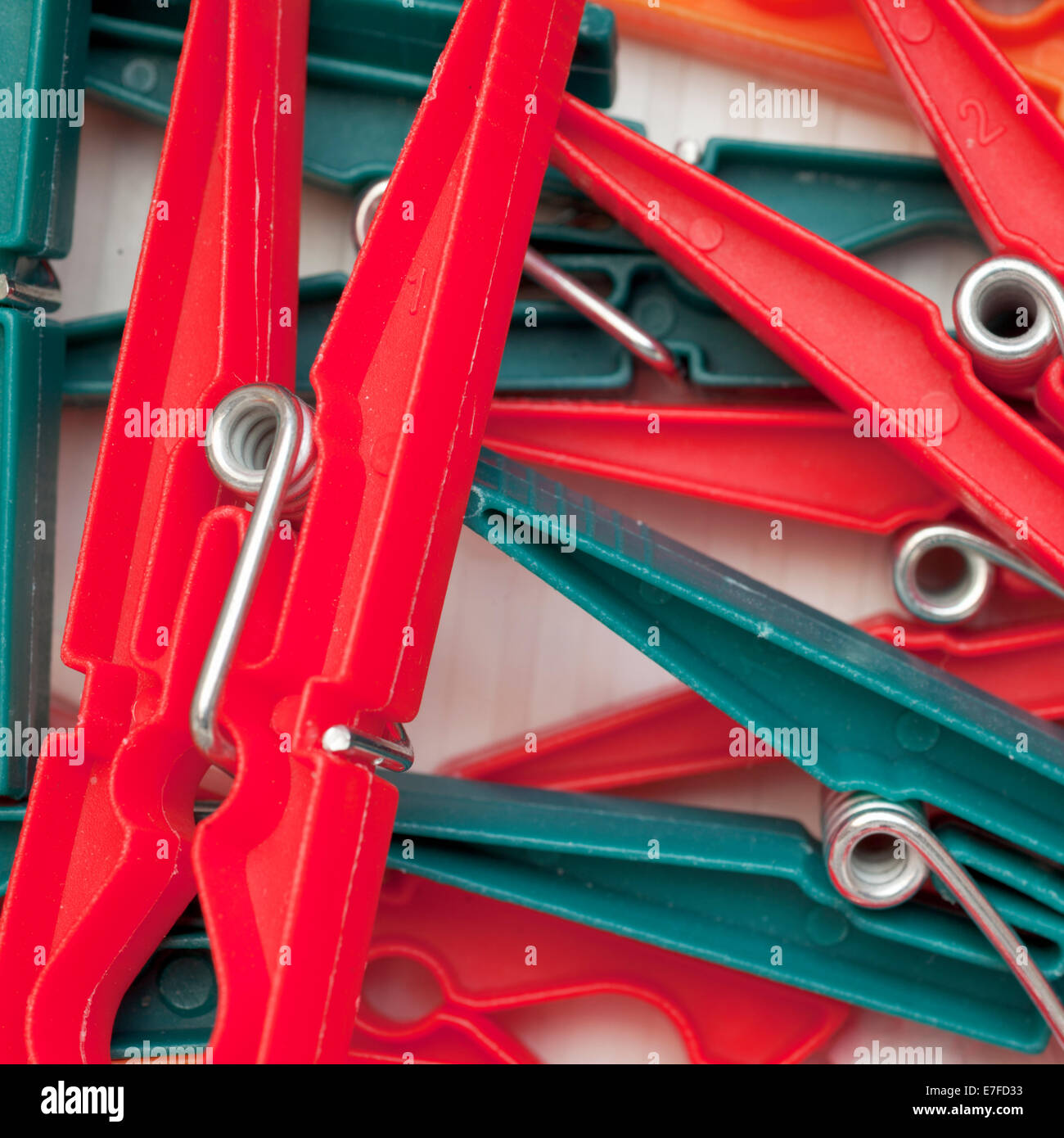 Close up of green and red clothes pegs Stock Photo