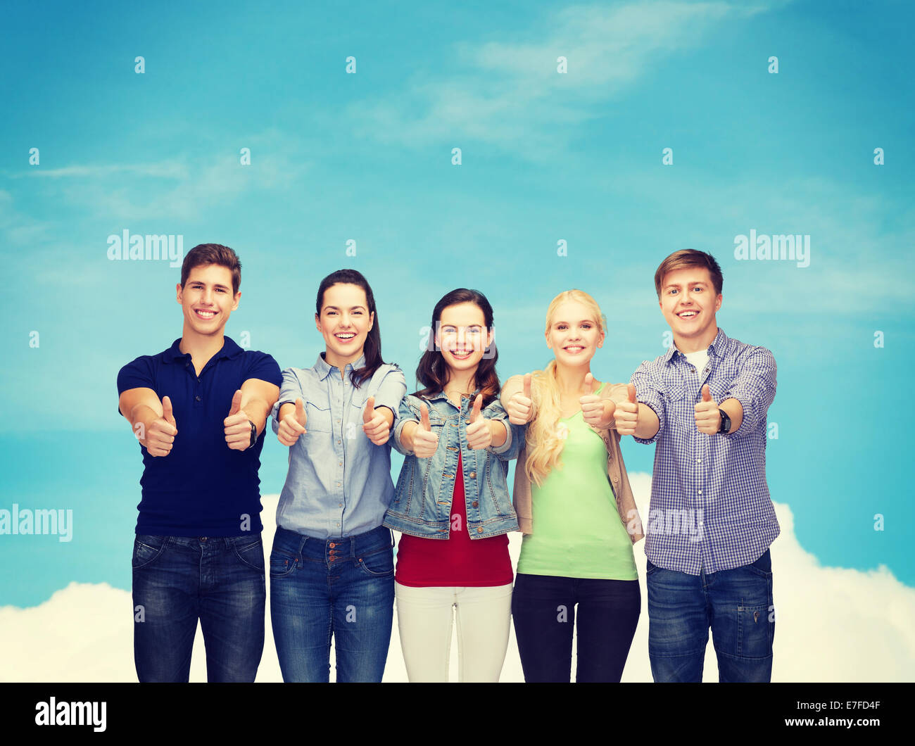 group of smiling students showing thumbs up Stock Photo - Alamy