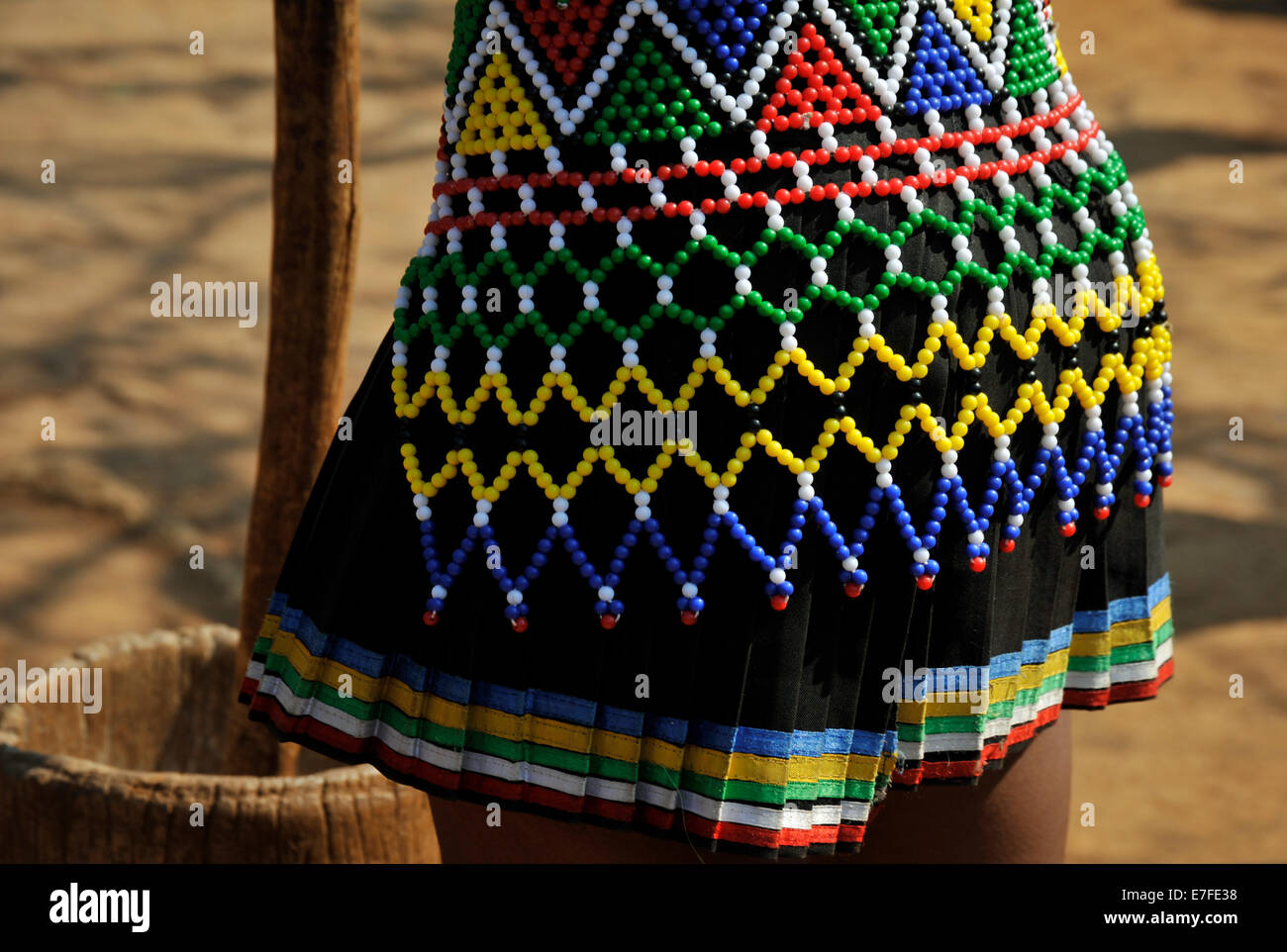 Clothes, people, culture, Eshowe, KwaZulu-Natal, South Africa, colourful beads, patterns on skirt of Zulu maiden, Shakaland theme village, woman Stock Photo
