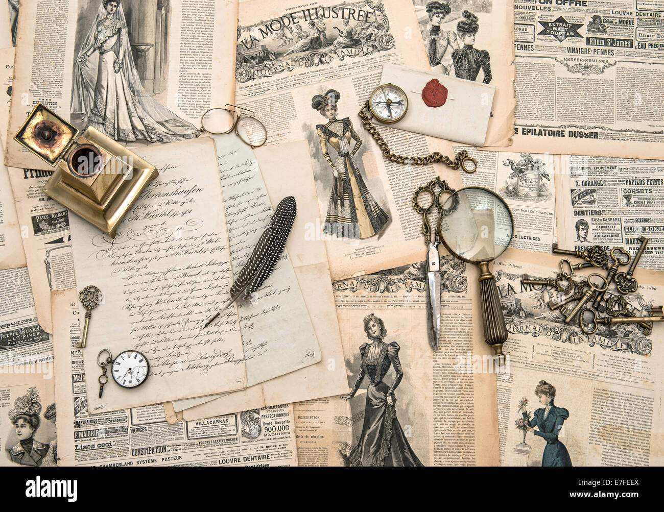 antique office accessories, writing tools, vintage fashion magazine for the woman from 1898. retro style toned picture Stock Photo