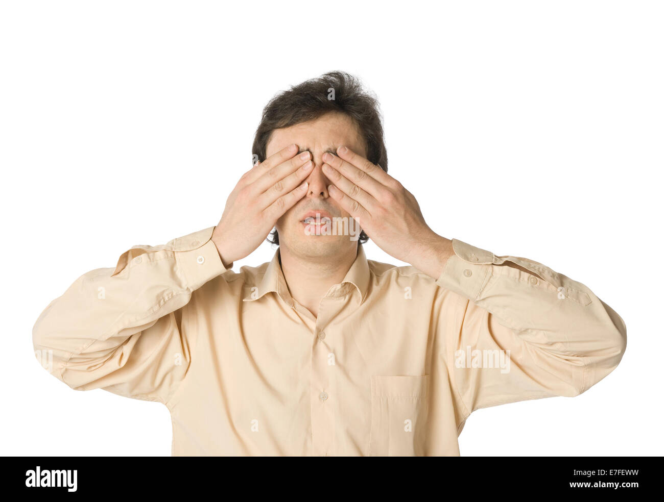 A man covering his eyes with his hands Stock Photo - Alamy