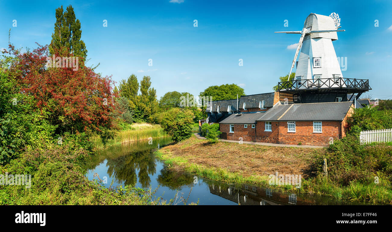 A smock windmill on the banks of the river Tillingham at Rye in East Sussex Stock Photo