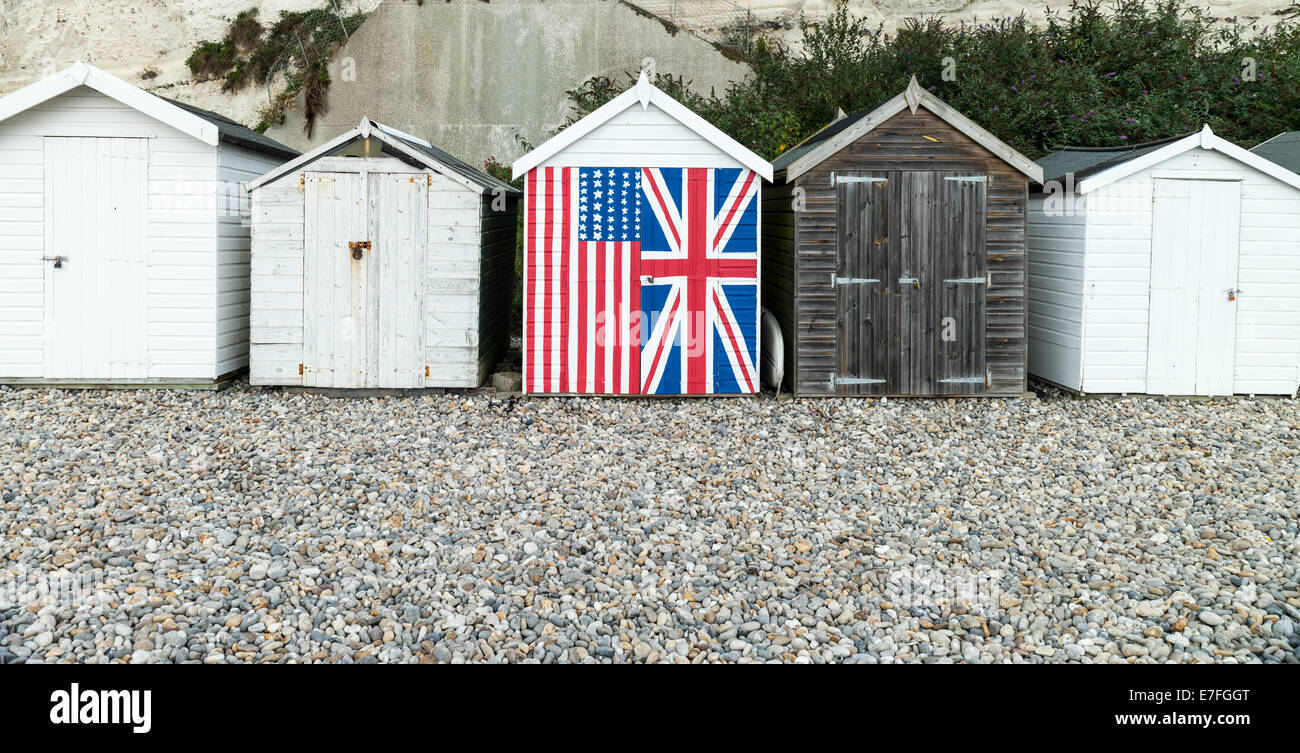 English beech hut with Union Jack and Stars and stripes painted on the front Stock Photo
