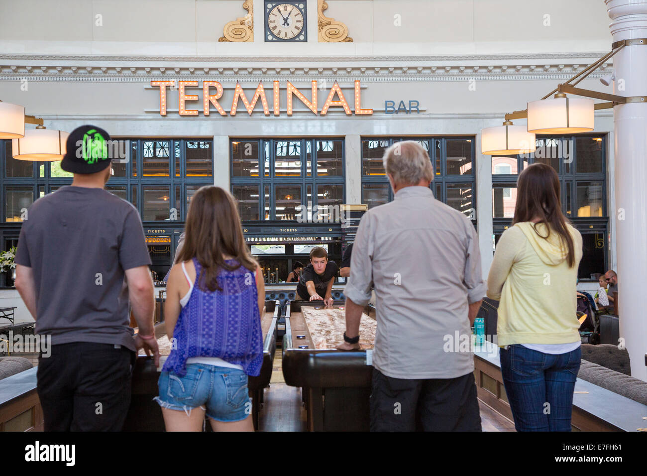 Denver, Colorado People play table shuffleboard in the Great Hall of