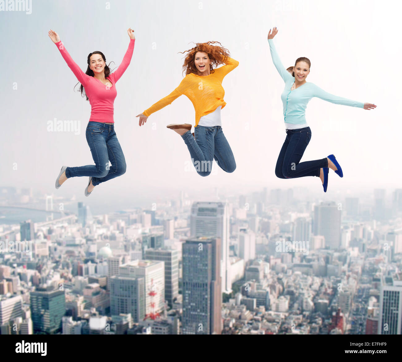 group of smiling women jumping in air Stock Photo - Alamy
