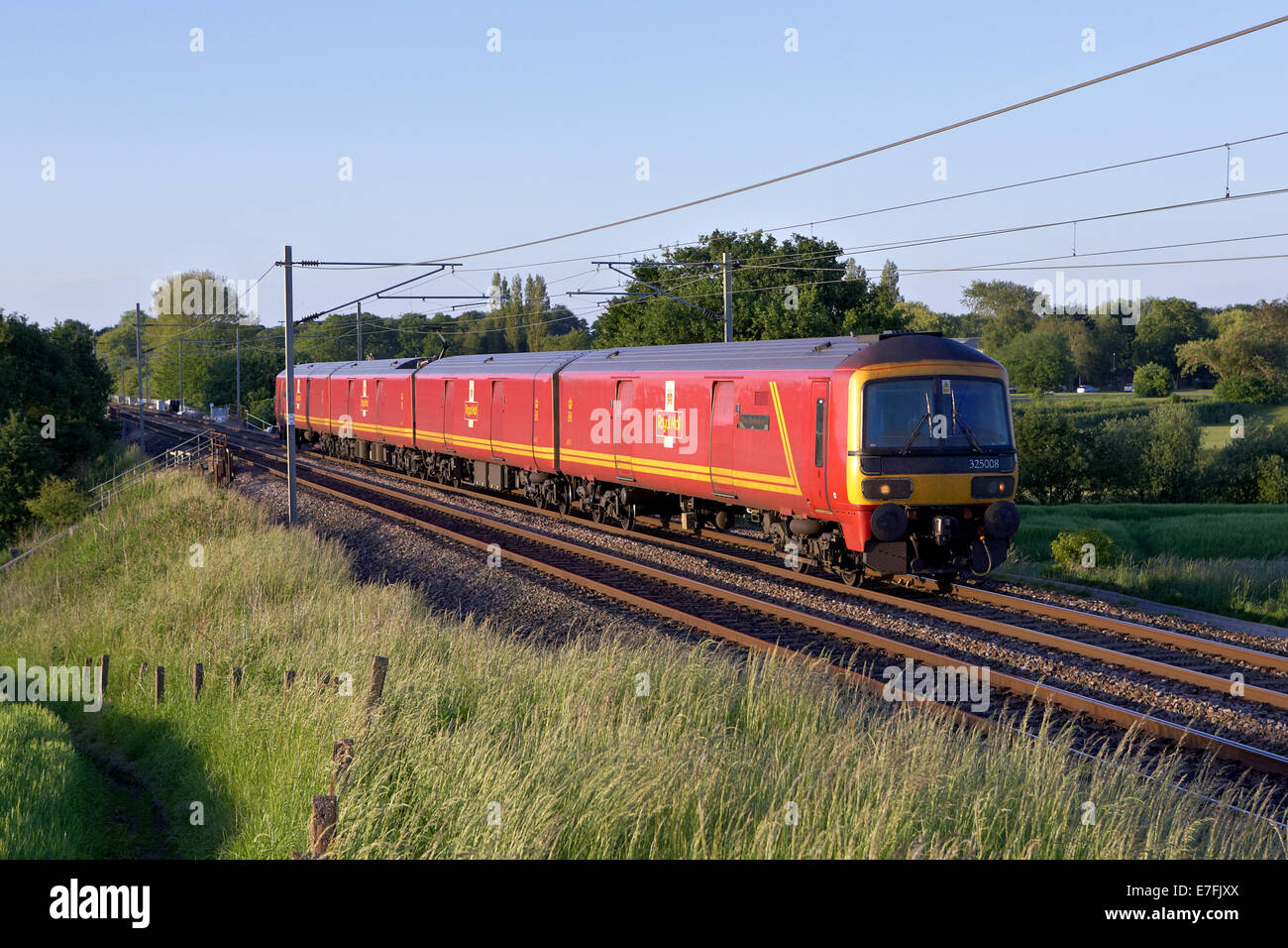 Royal Mal class 325 no 325008 heads south through red bankon the west coast mainline with a warrington to crewe mail service on Stock Photo