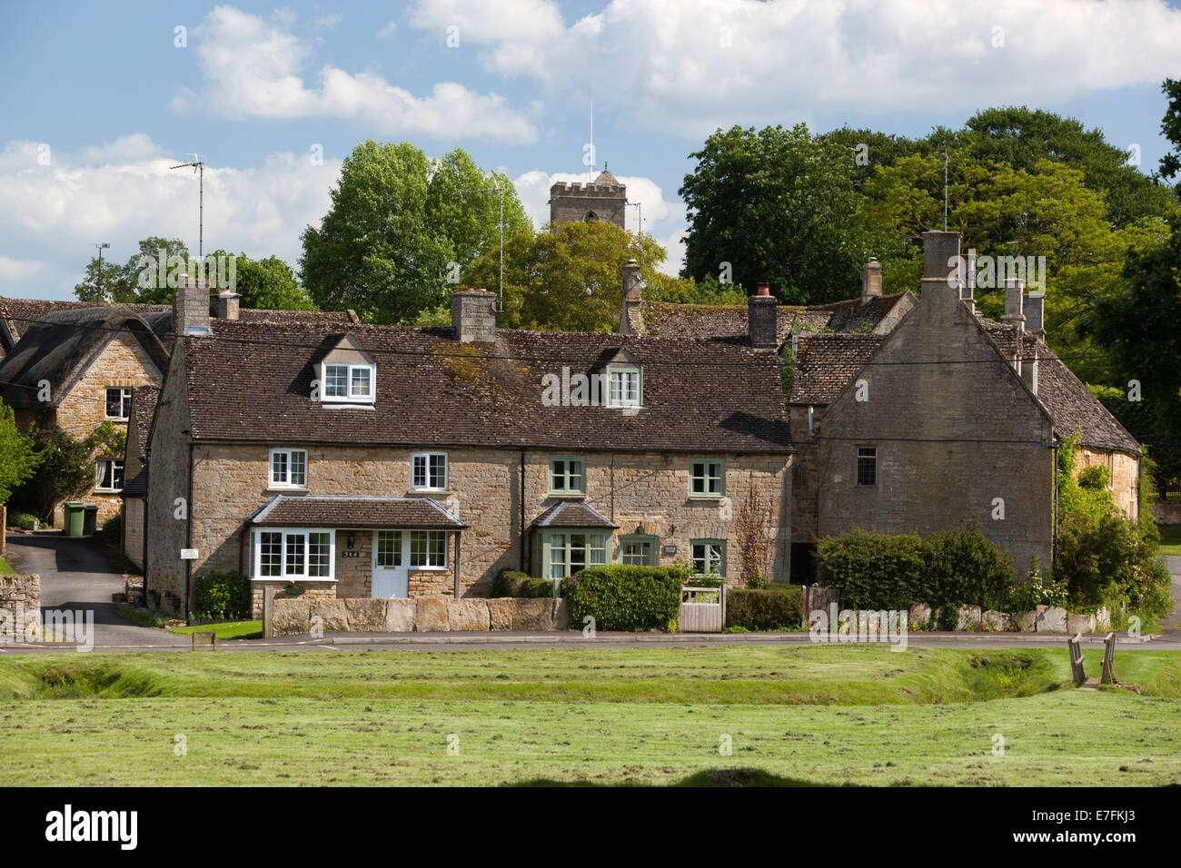 Cotswold cottages on village green, Bledington, Cotswolds, Gloucestershire, England, United Kingdom, Europe Stock Photo