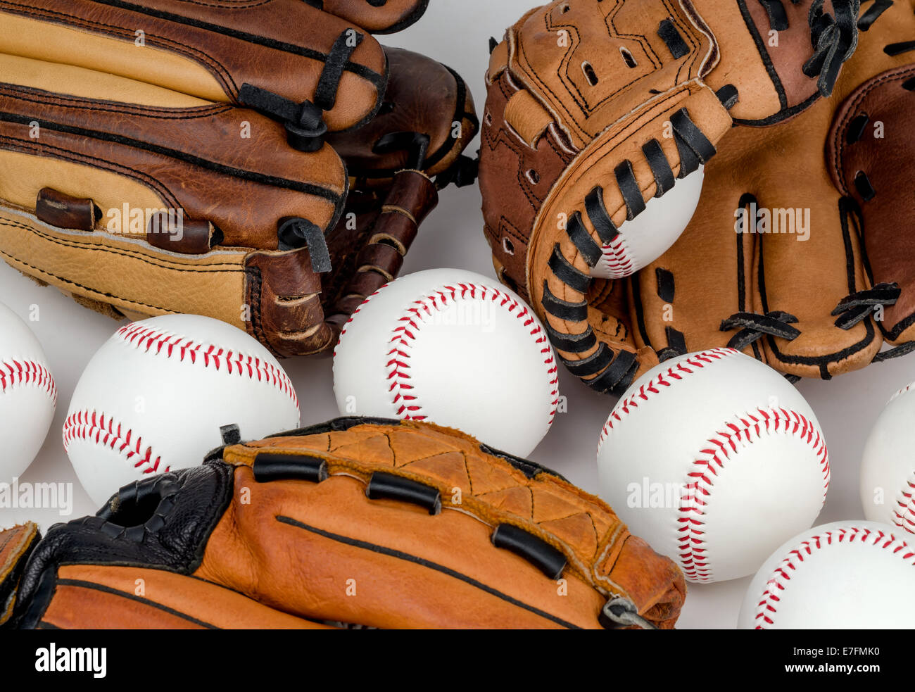 Collection of Baseball Gloves and Baseballs. Stock Photo