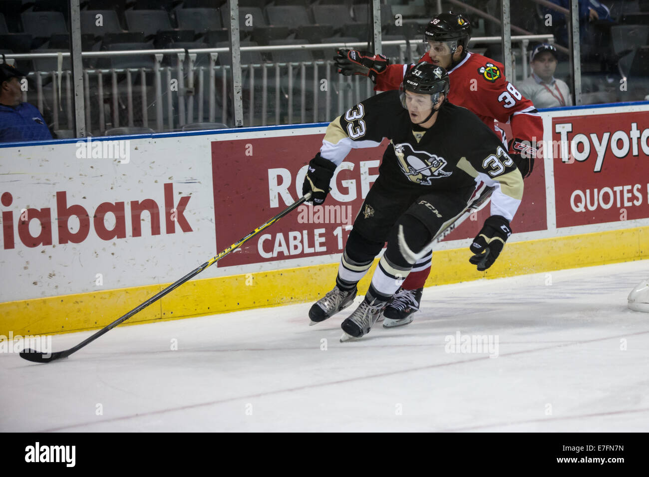 London, Ontario, Canada. September 14, 2014. Reid McNeill (33) of the Pittsburgh Penguins carries the puck during a game between the Pittsburgh Penguins and the Chicago Blackhawks at the 2014 NHL Rookie Tournament being played at Budweiser Gardens. © Mark Spowart/Alamy Live News Stock Photo