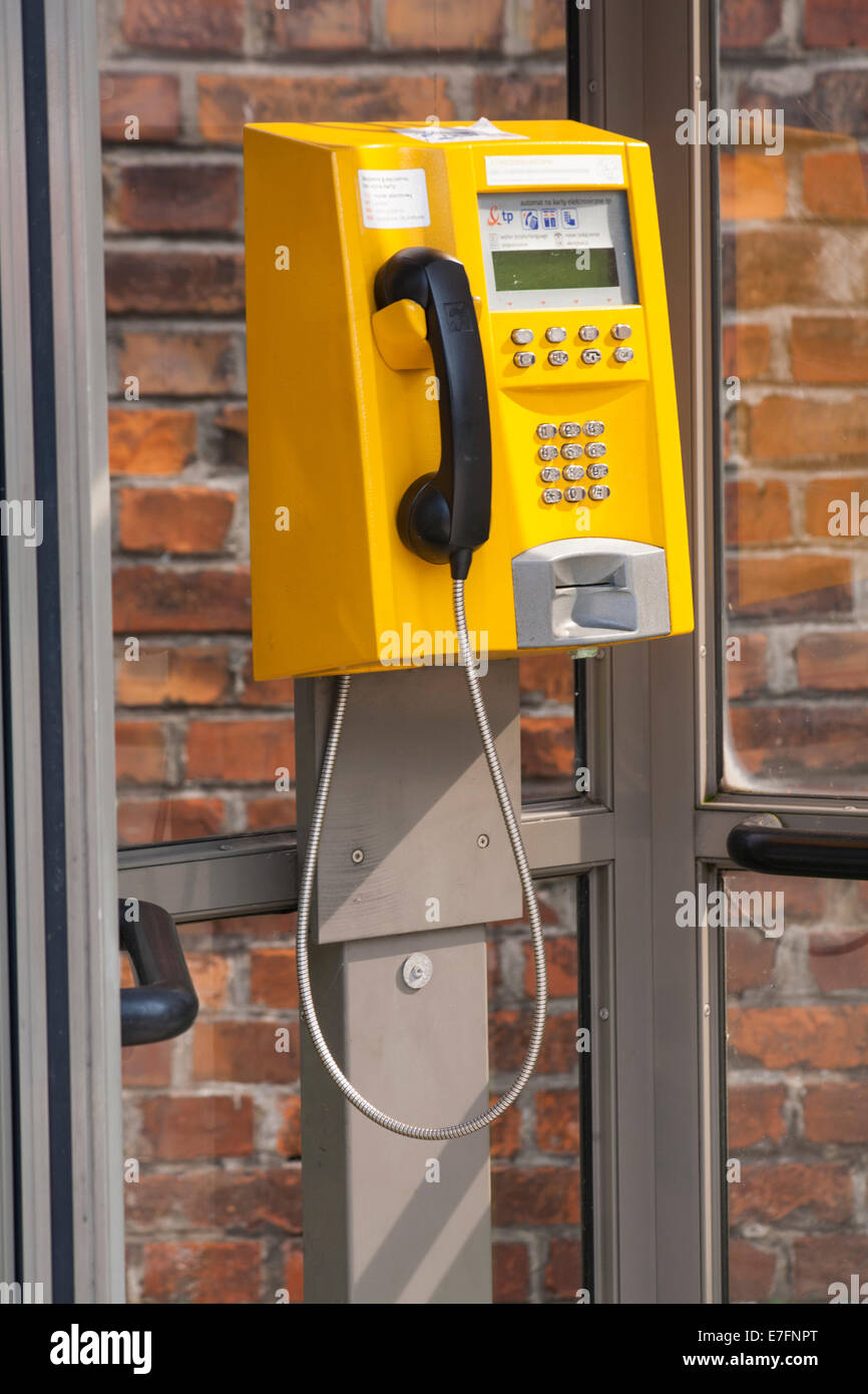 Yellow glass telephone booths with payphones are located on a pedestrian  street. Obsolete means of telephone communication in free access. Bialystok  Stock Photo - Alamy