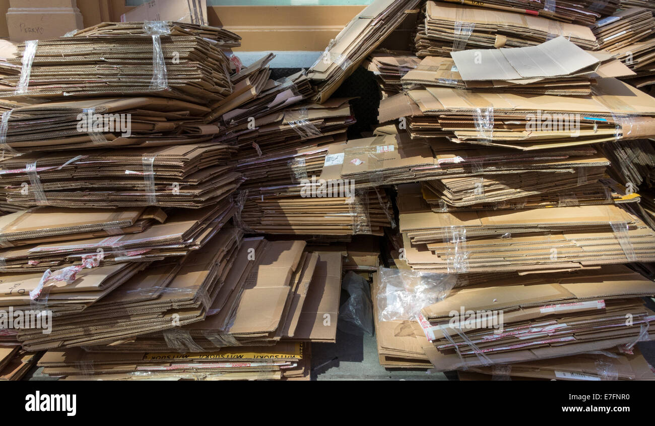 Used boxes broken down and left on the street for trash collection in