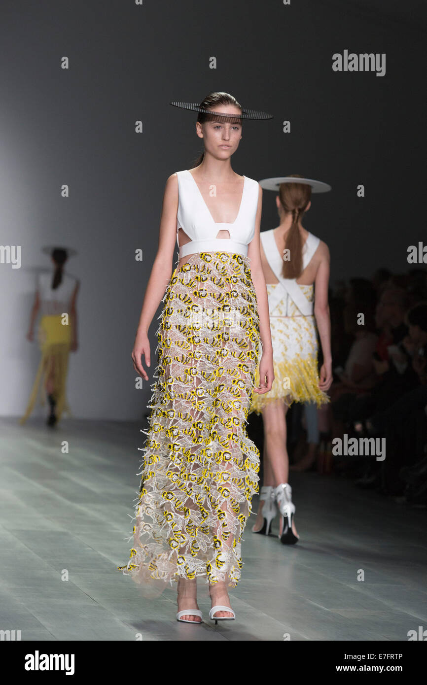 London, UK. 16 September 2014. A model walks the runway at the Honeybee-inspired show H by Hakaan Yildirim show at London Fashion Week SS15 at the BFC Courtyard Show Space in London, England. Photo: CatwalkFashion/Alamy Live News Stock Photo