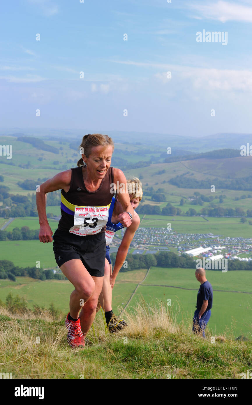 Lady Fell runner competing in a fell race Stock Photo