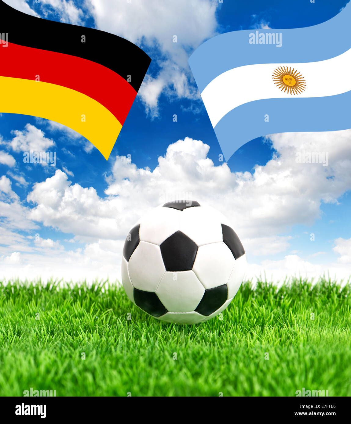 Soccer ball on green grass and national flags of Germany and Argentina over dramatic blue sky. Collage Stock Photo