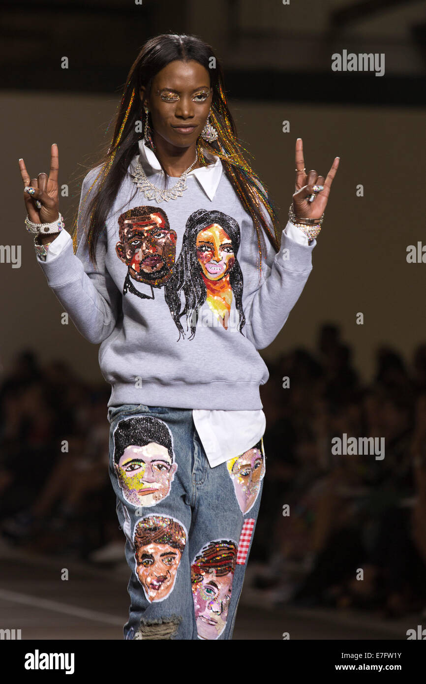 London, UK. 16 September 2014. A model wearing a Kim Kardashian and Kanye West sequined jumper walks the runway at the Ashish show at London Fashion Week SS15 at the Topshop Show Space in London, England. Photo: CatwalkFashion/Alamy Live News Stock Photo
