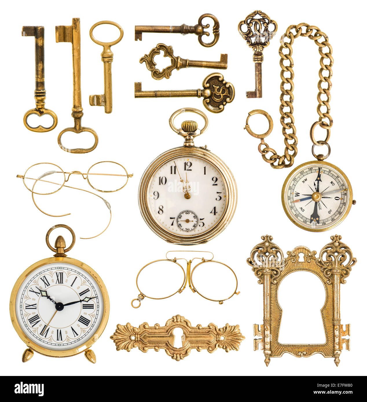 collection of golden antique accessories. vintage keys, clock, compass