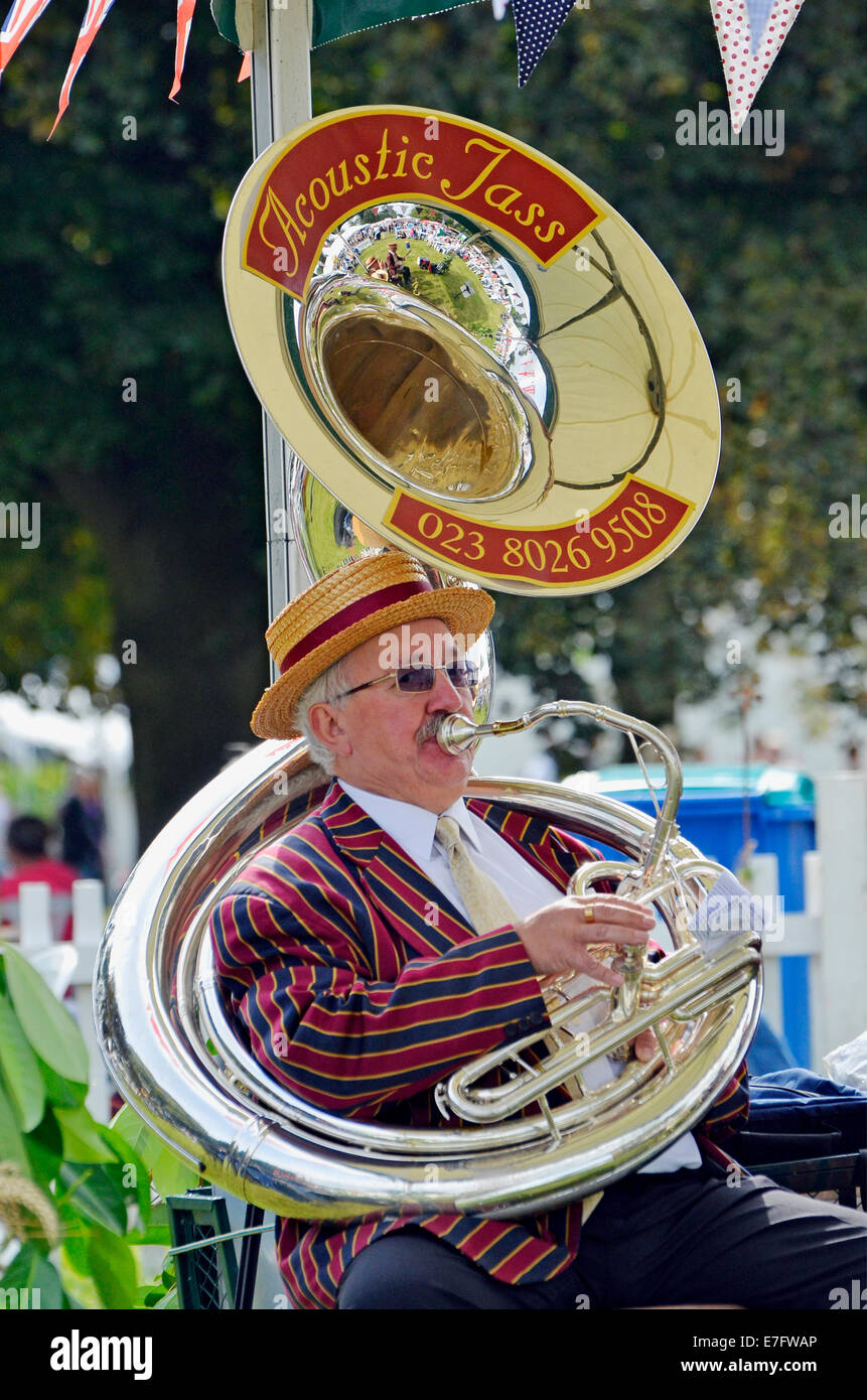 Musician playing a sousaphone in a jazz ensemble providing entertainment at a country fair. Stock Photo