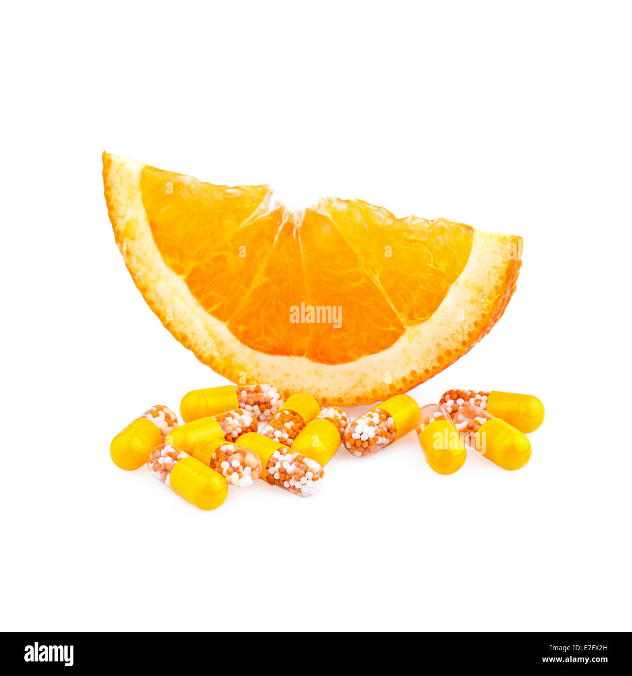 Vitamin pills and Orange Fruit Stock Photo