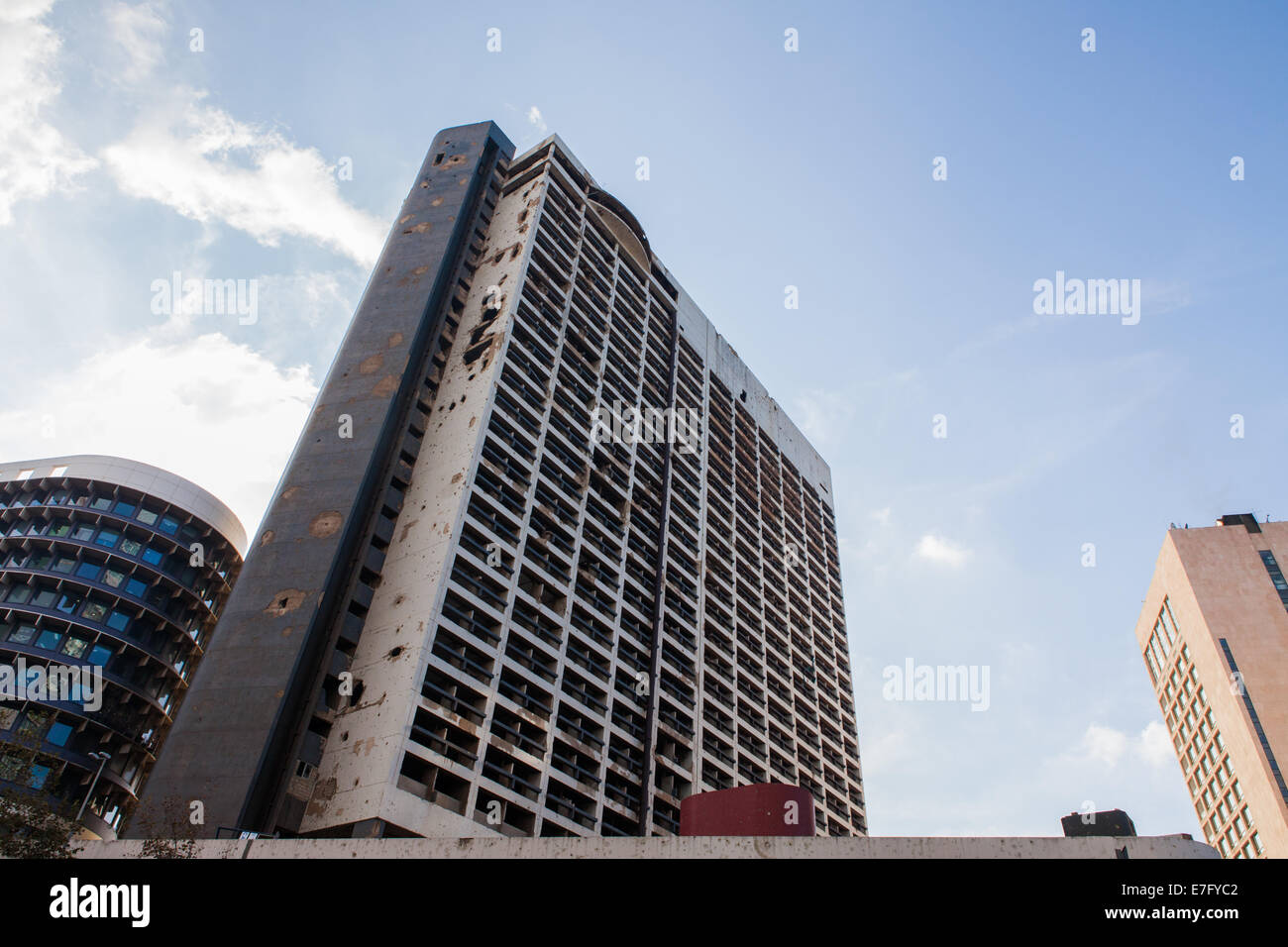 High-rise building that was badly damaged and burned out during the Lebanese civil war, in Beirut Central District (Downtown). Stock Photo
