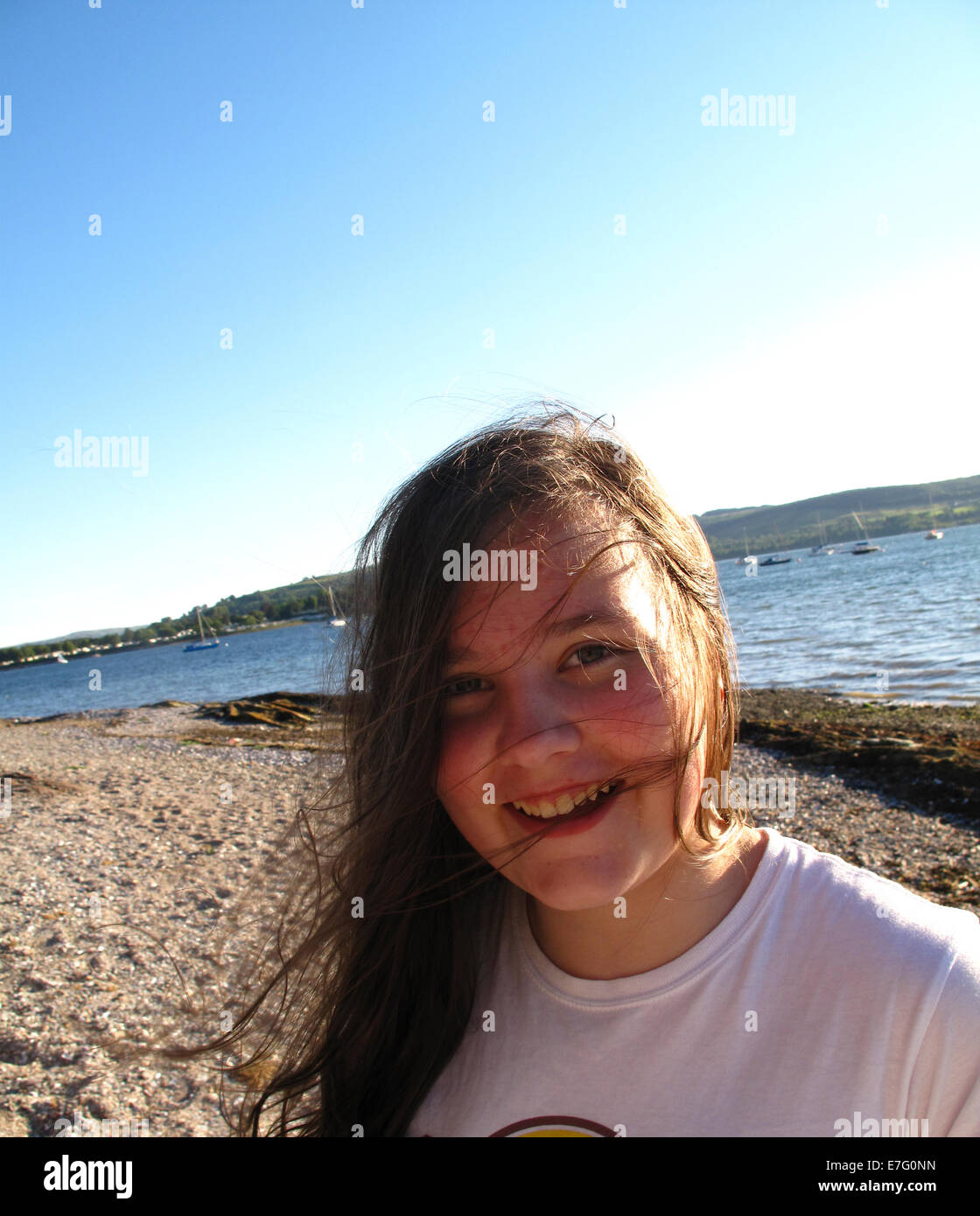 Young girl posing in sunshine backlit sidelit Stock Photo