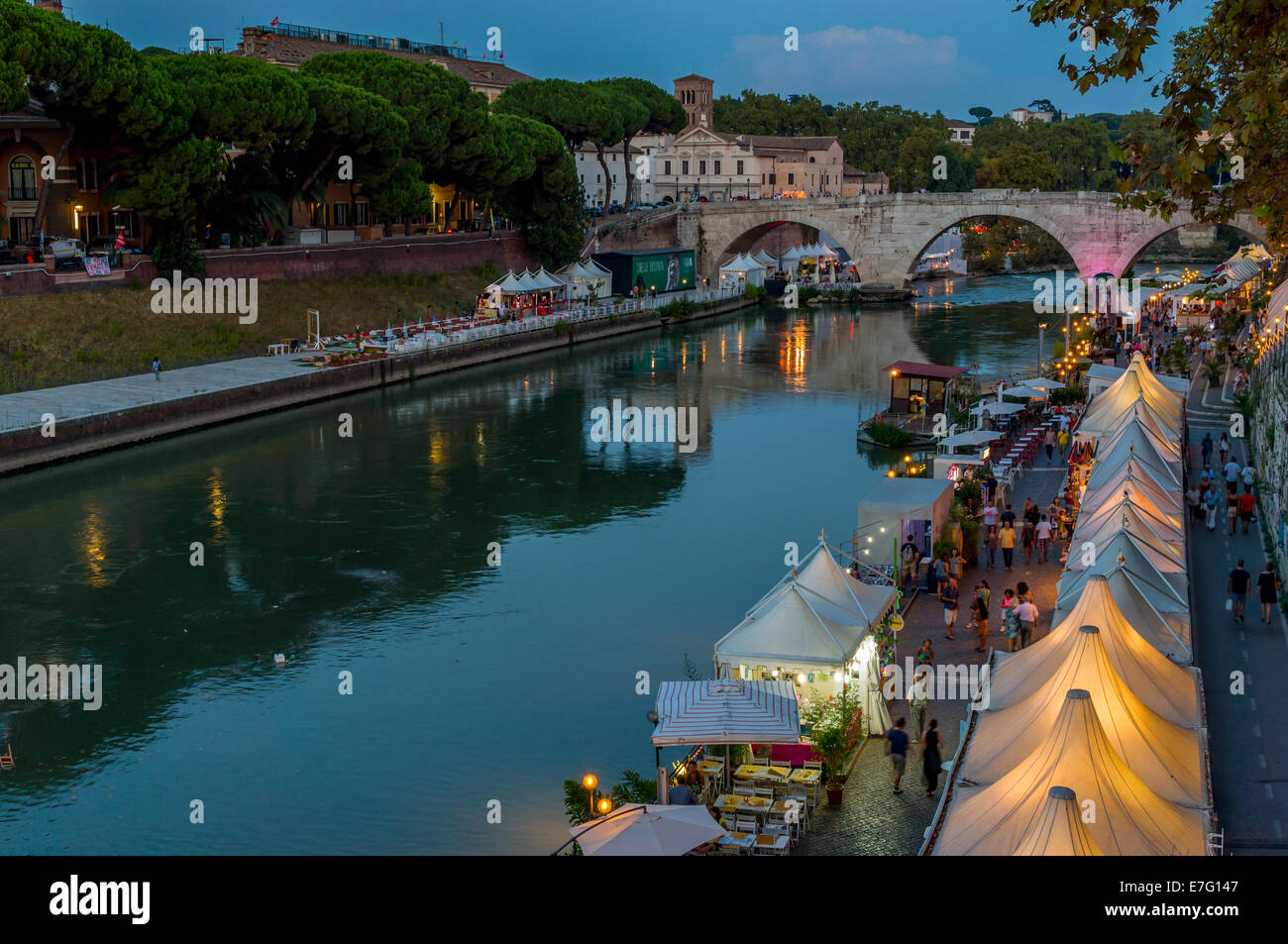 View of the summer market along the Tiber River (Lungo Tevere) and Tiber Island (Isola Tiberina) in Rome Stock Photo