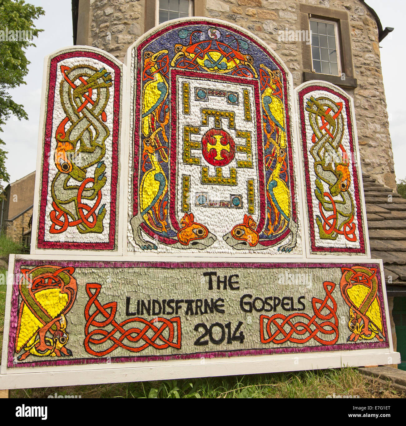 Unique and colourful design created entirely from flower petals to celebrate well dressing tradition at  village of Bakewell Stock Photo