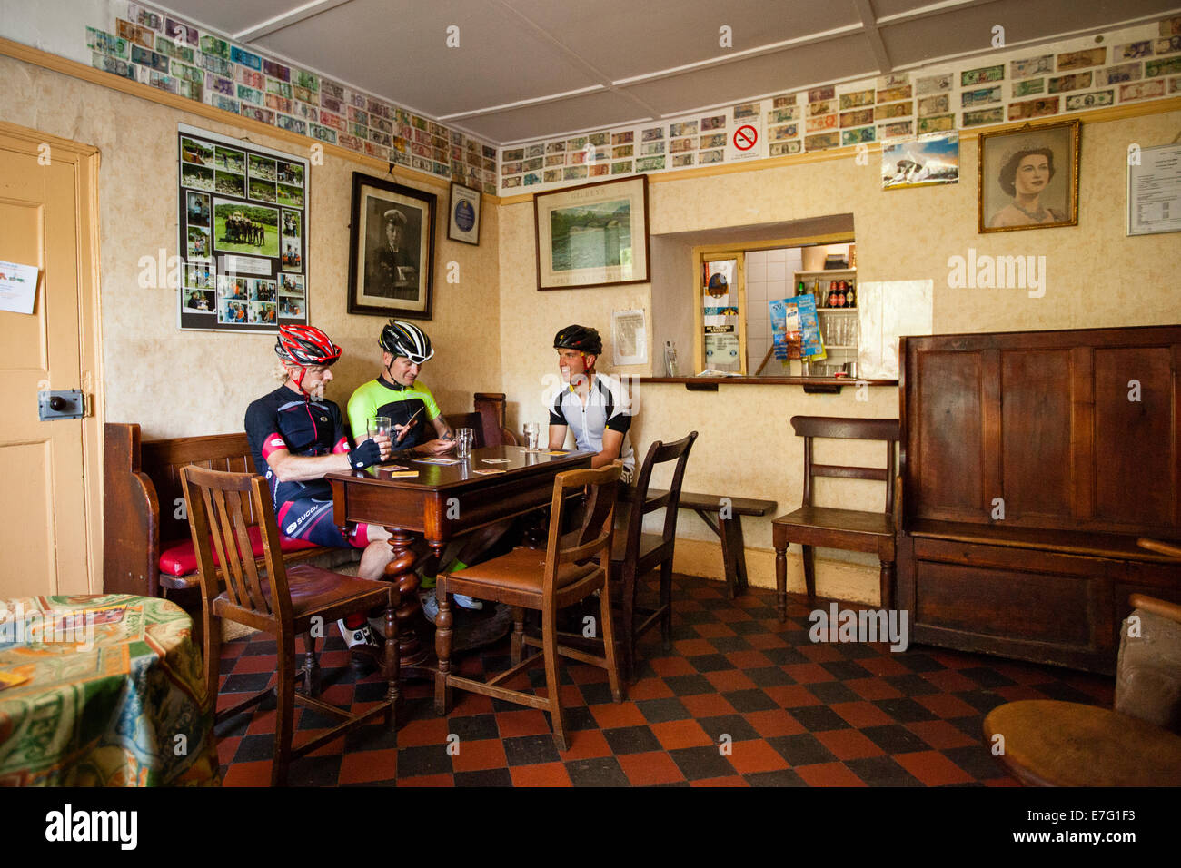 Three cyclists stop at a pub in Pembrokeshire, Wales Stock Photo