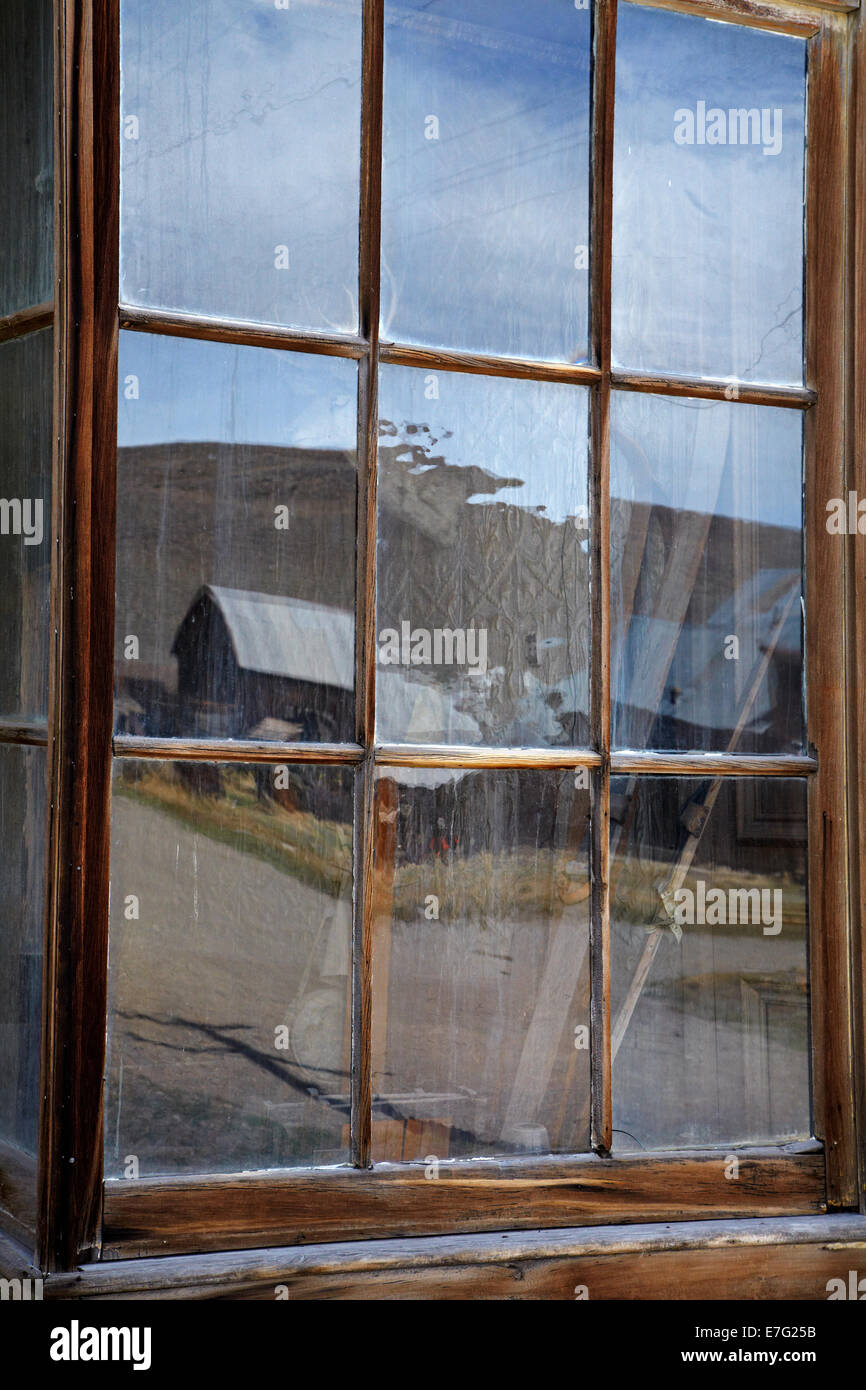 Reflection in window of Wheaten and Hollis Hotel, Bodie Ghost Town, Eastern Sierra, California, USA Stock Photo