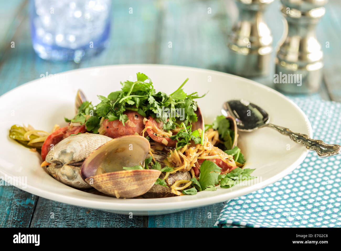 Clams and Portuguese sausage stirfried with garlic, ginger and