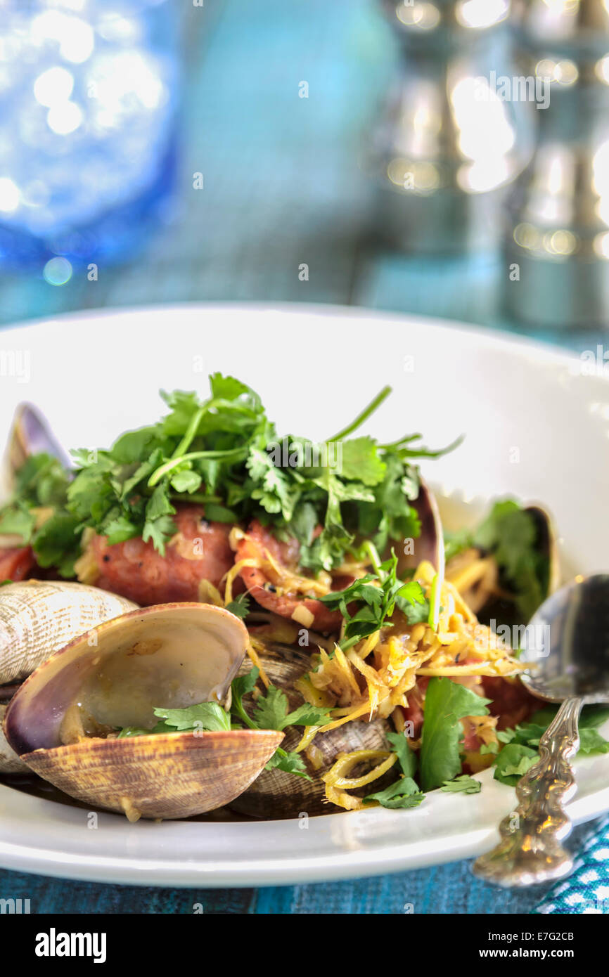 Clams and Portuguese sausage stirfried with garlic, ginger and