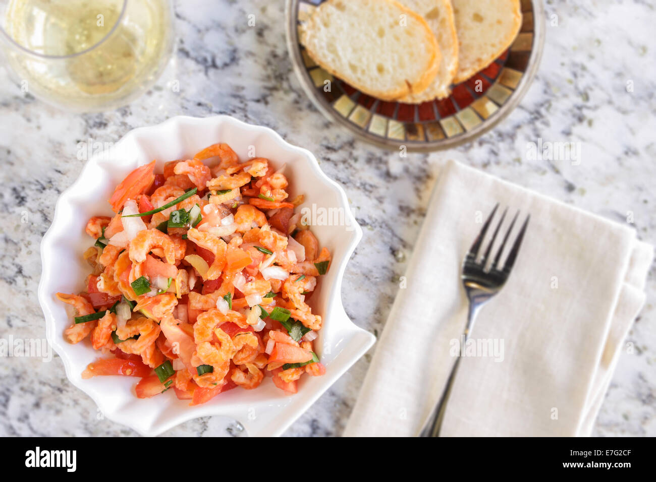 Dried shrimp mixed with tomatoes, onion, ginger, green onions, rice