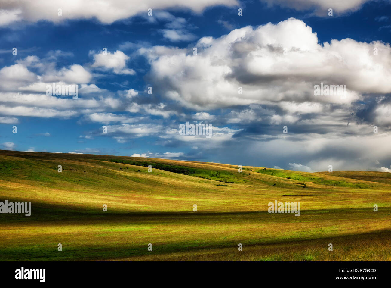 Beautiful clouds pass over the rolling hills of NE Oregon’s Zumwalt Prairie Preserve in Wallowa County. Stock Photo