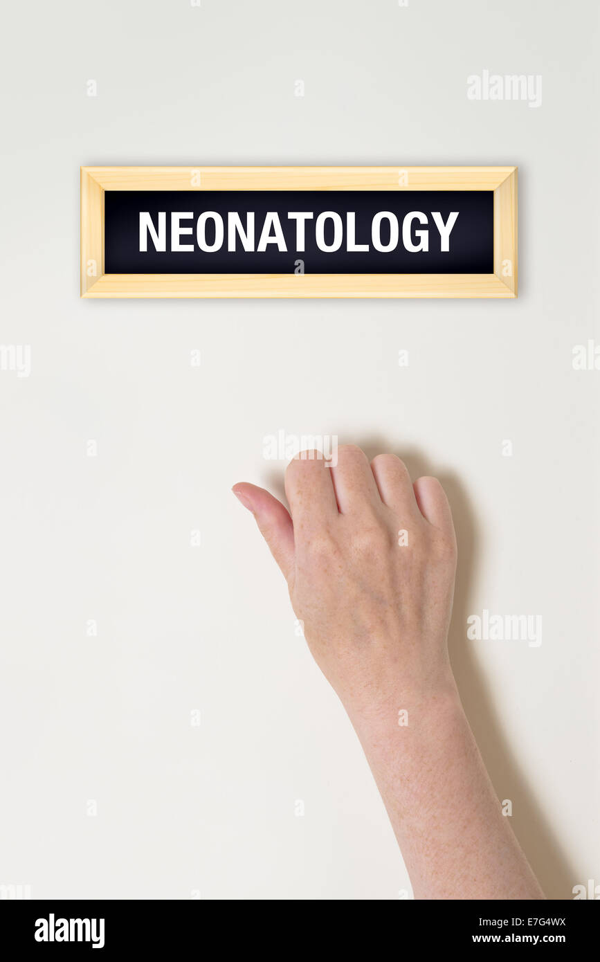 Female hand is knocking on Neonatology door for a medical exam Stock Photo