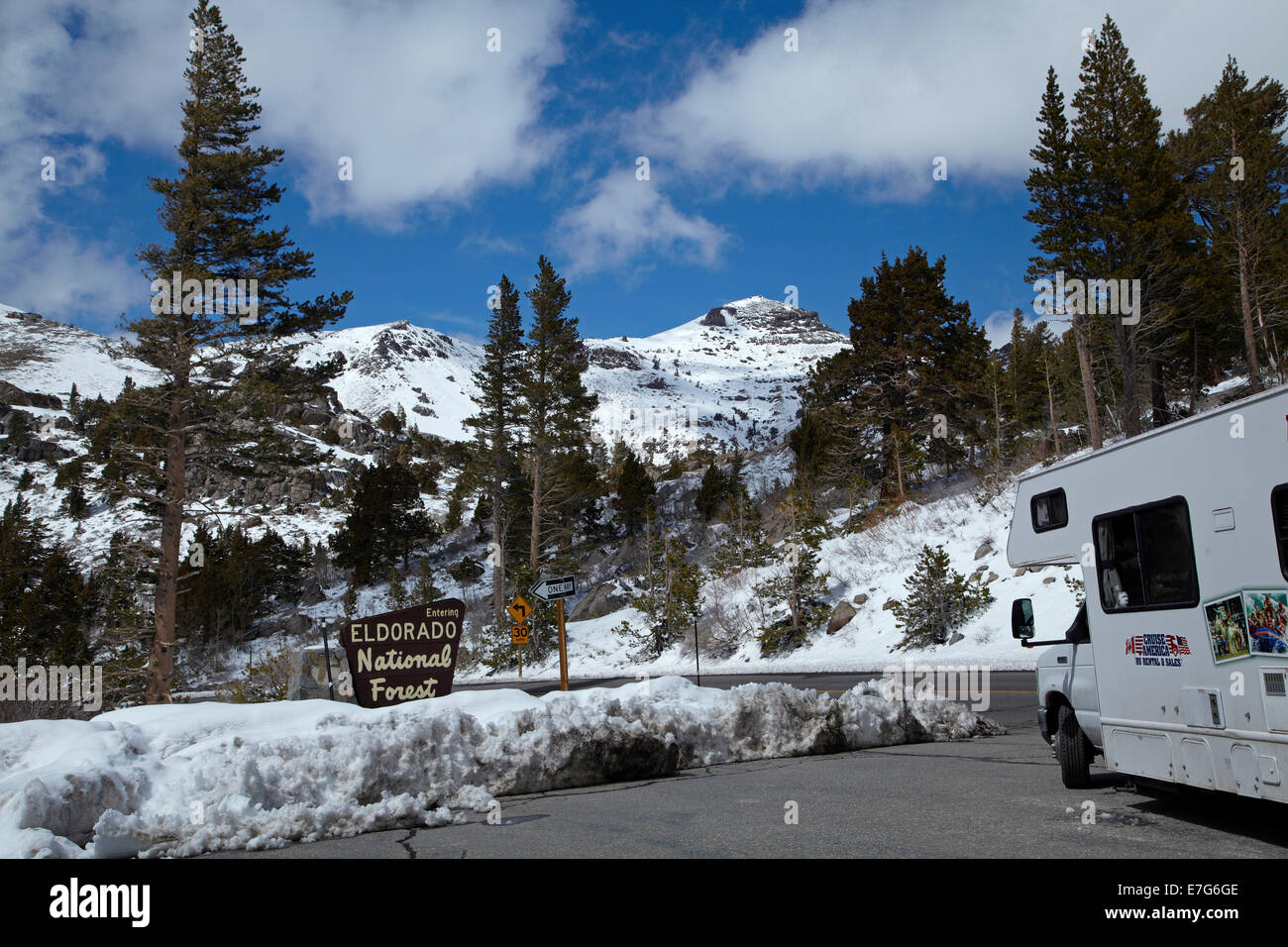 RV and snow at summit of Carson Pass Highway (SR 88), 8,574 ft / 2,613 m, over Sierra Nevada, California, USA Stock Photo