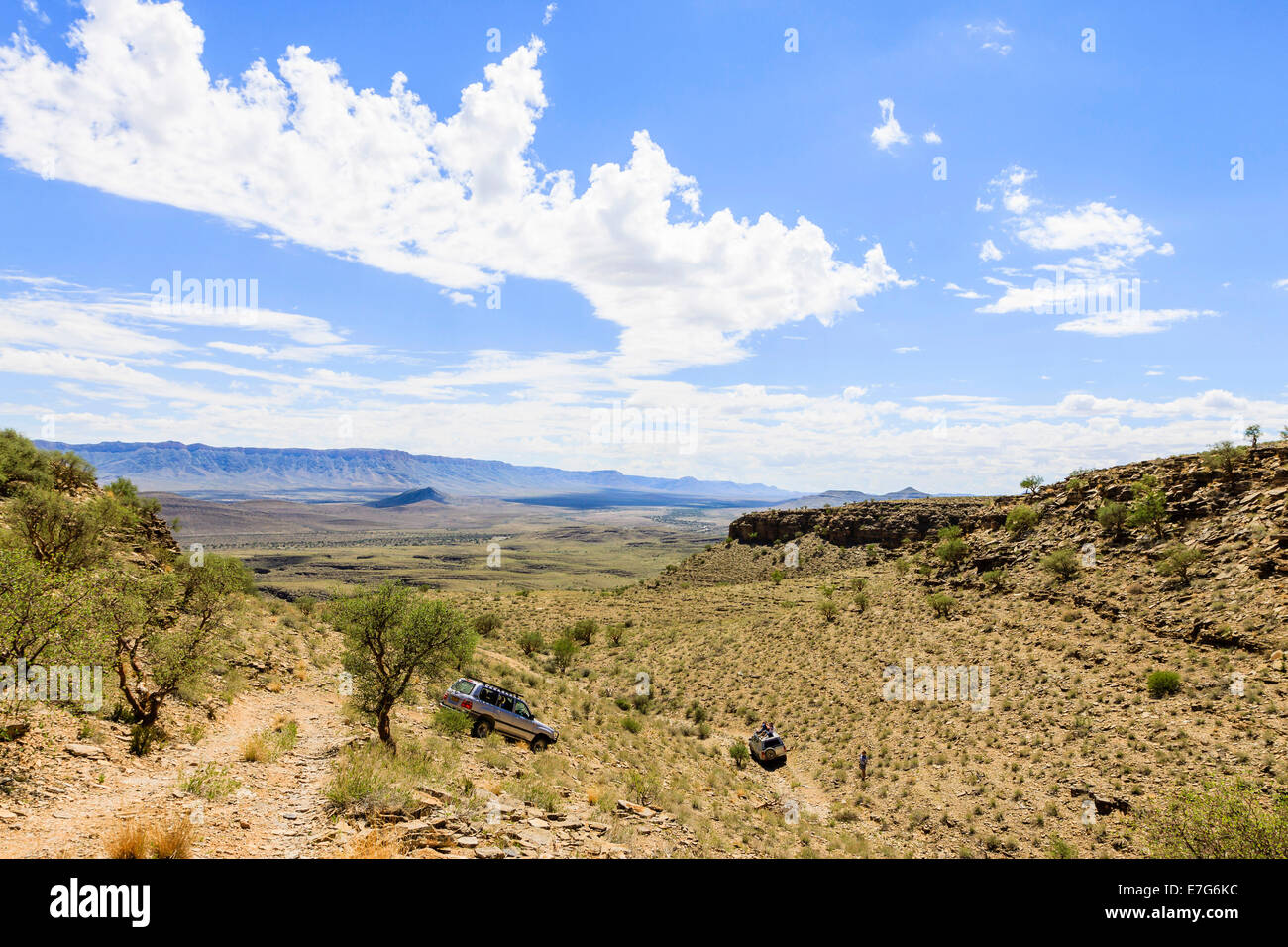 SUV driving through arid landscape, Tsauchab, Namibia Stock Photo