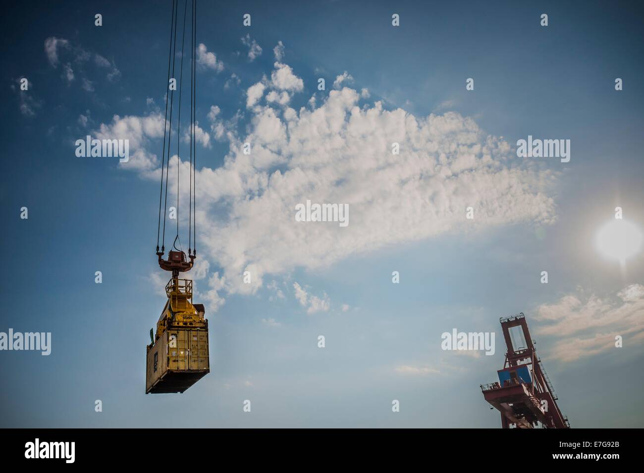 Containers have characterized and changed since the 50s of last century the trade in goods and the worldwide traffic. Pictures about container loading are icon images and an illustrations for news on industry, business and economy. 10 July 2014 Stock Photo