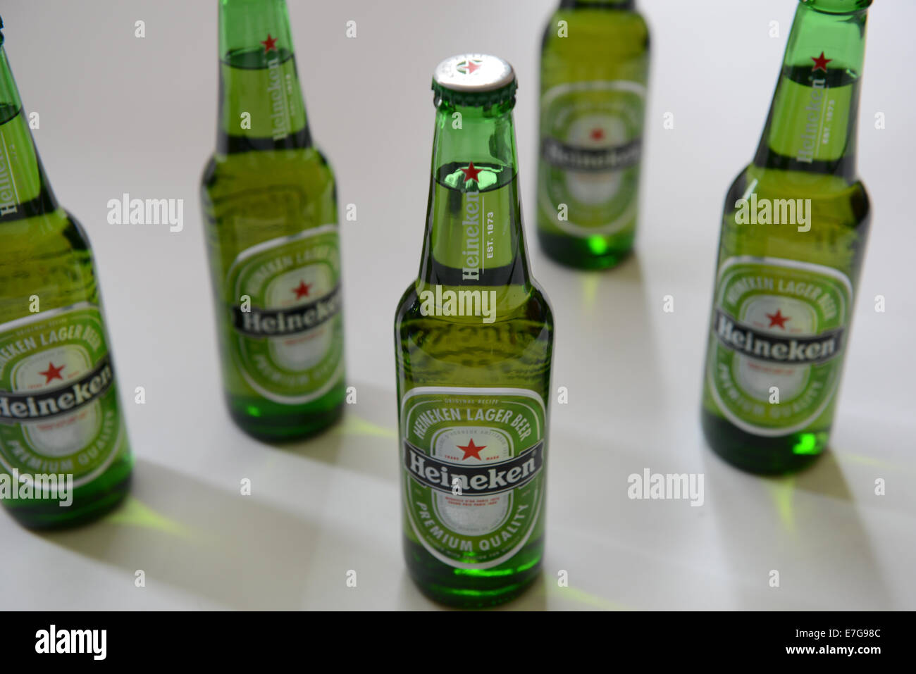 Five heineken bottles against a white background Stock Photo Alamy