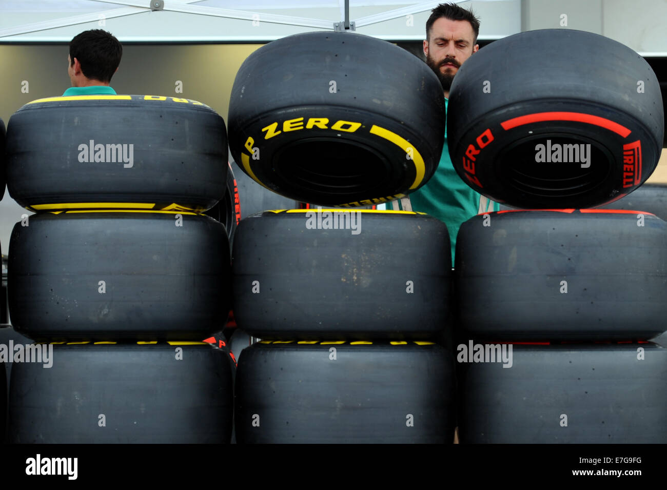 Singapore, Sept. 17. 19th Sep, 2014. A member of the Mercedes team arranges tires in Singapore, Sept. 17, 2014. The Singapore Grand Prix is going to be held on Sept. 19, 2014. © Then Chih Wey/Xinhua/Alamy Live News Stock Photo