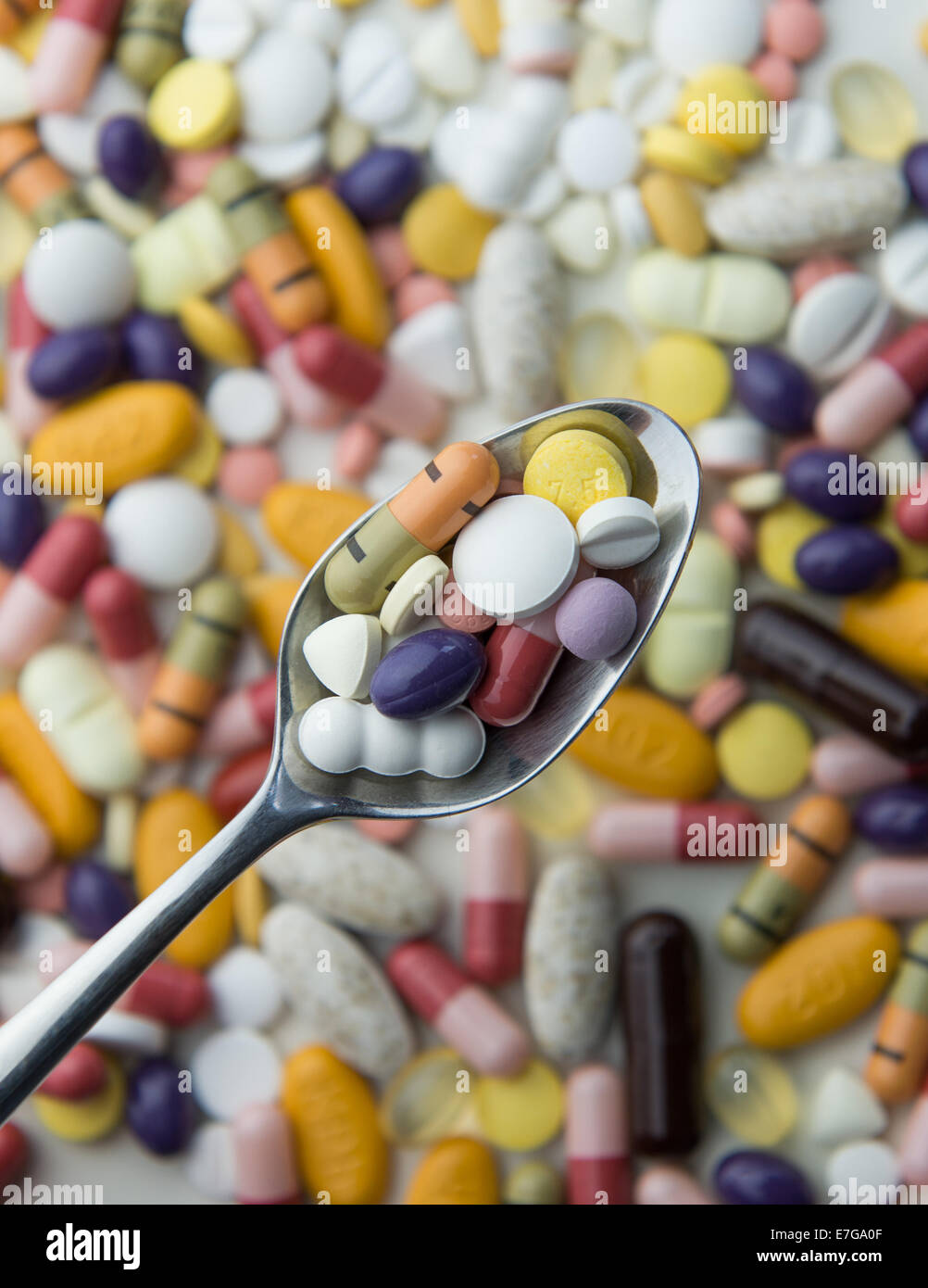 Tablets and pills on a table and on a spoon, 18 August 2014 in Hamburg. Stock Photo