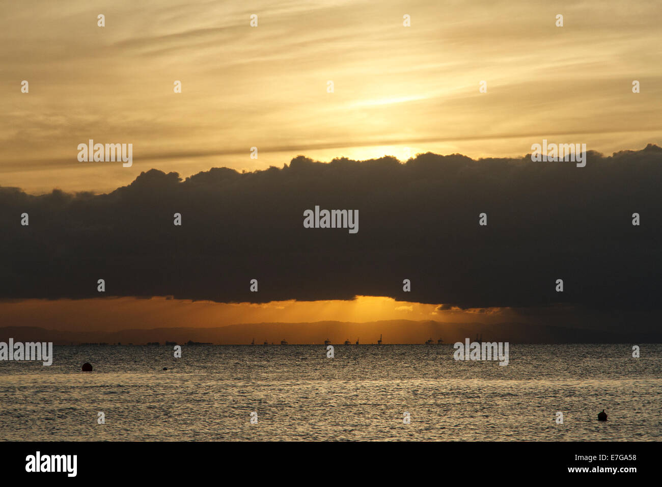 Sunset at Amity with the Port of Brisbane in the distance Stock Photo ...