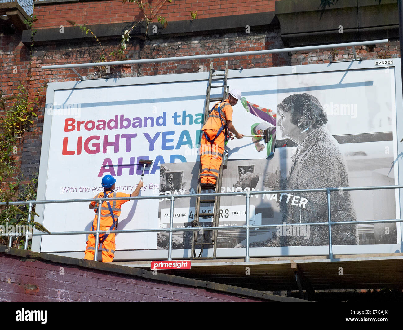 Placarding a billboard in Manchester UK Stock Photo