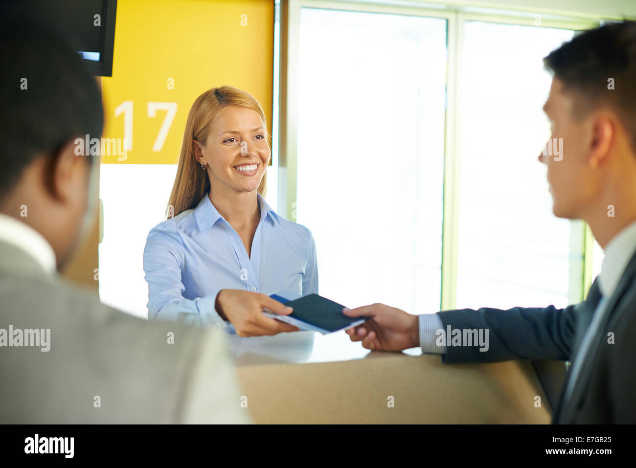 Employee taking tickets airport hi-res stock photography and images - Alamy